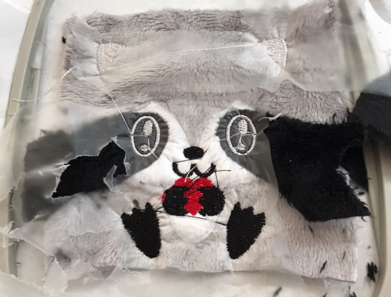 Raccoon features stitched