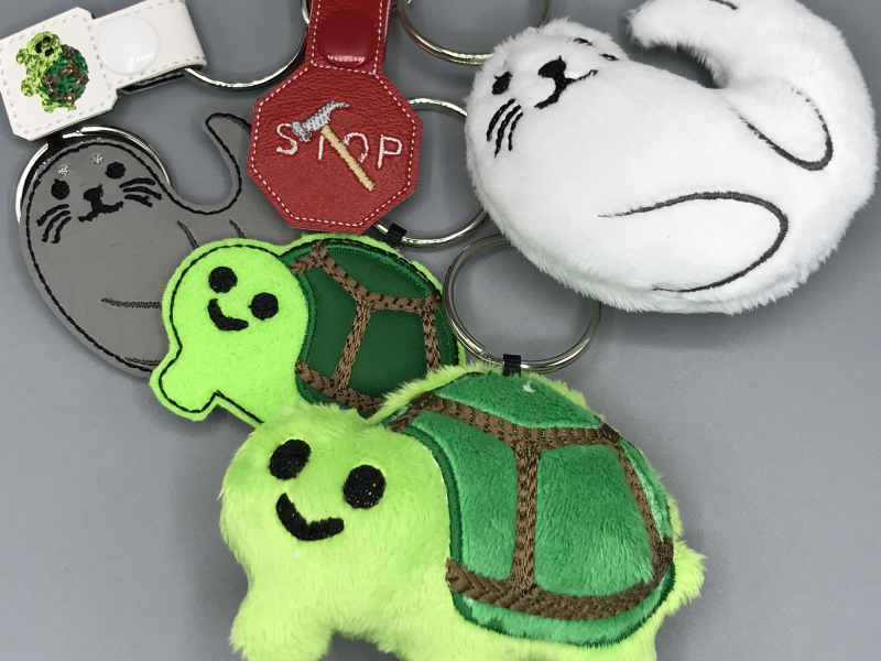 A collection of emoji-based charms and keychains.