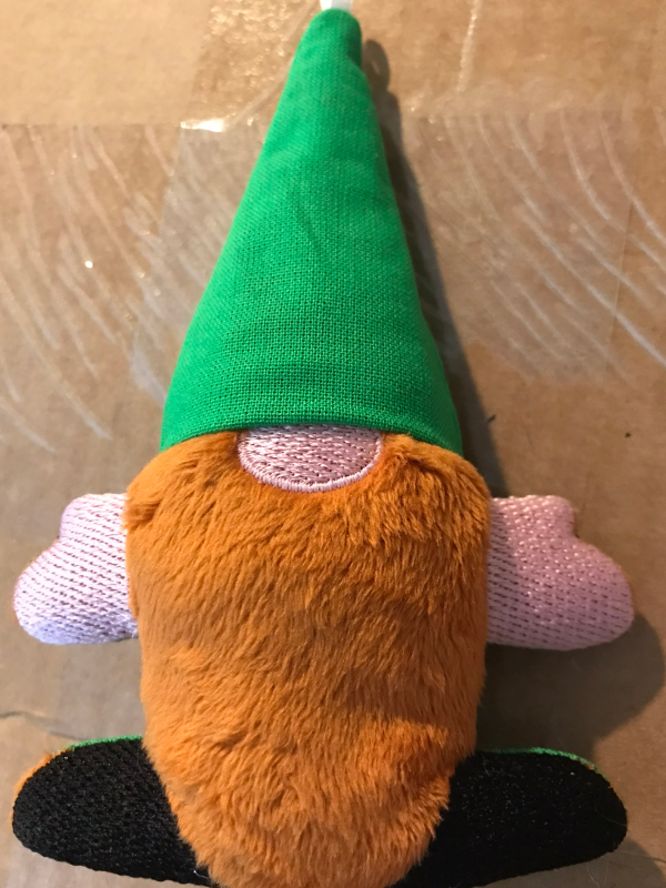 Plush gnome with red beard, pink hands and nose, black boots, green hat, and apparently nothing else