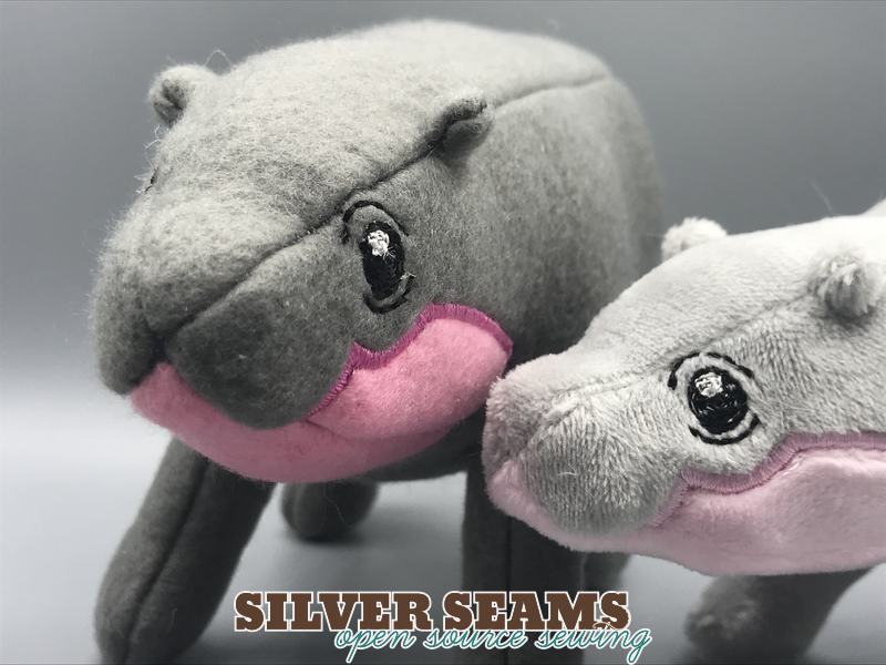 Three different sizes of pygmy hippo plushies