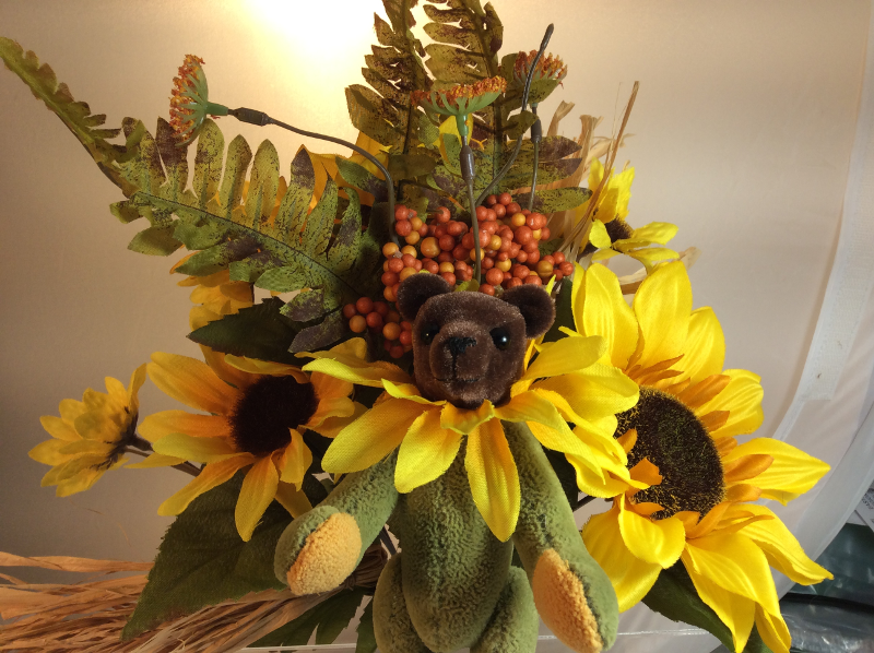 giant teddy bear and flowers