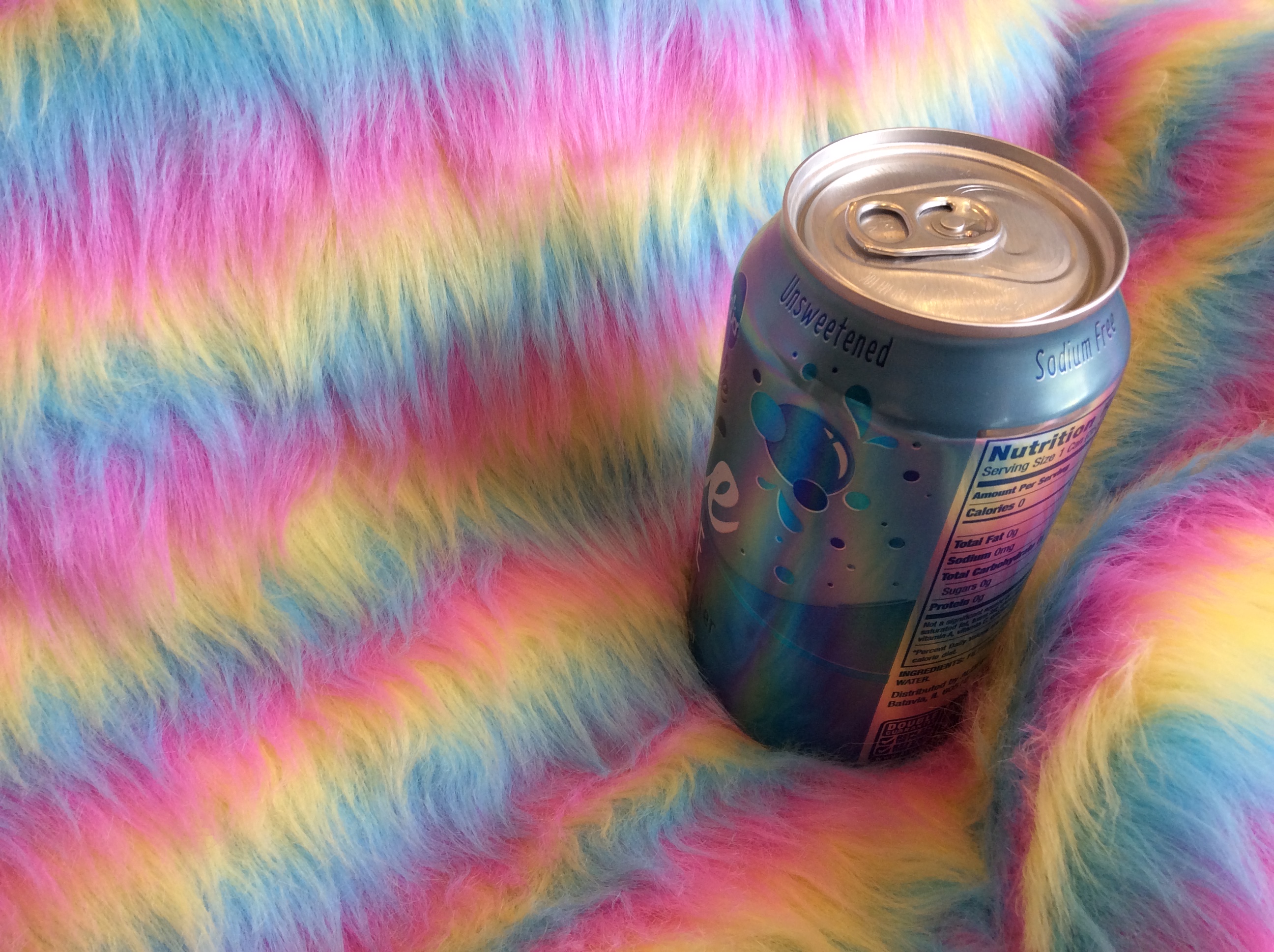 Striped faux fur with seltzer can for scale