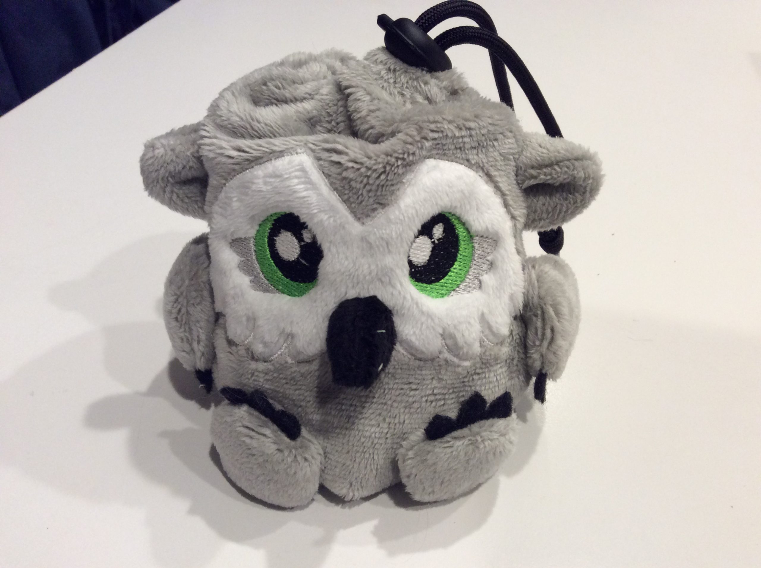 A tiny plush owlbear that is also a dice bag.