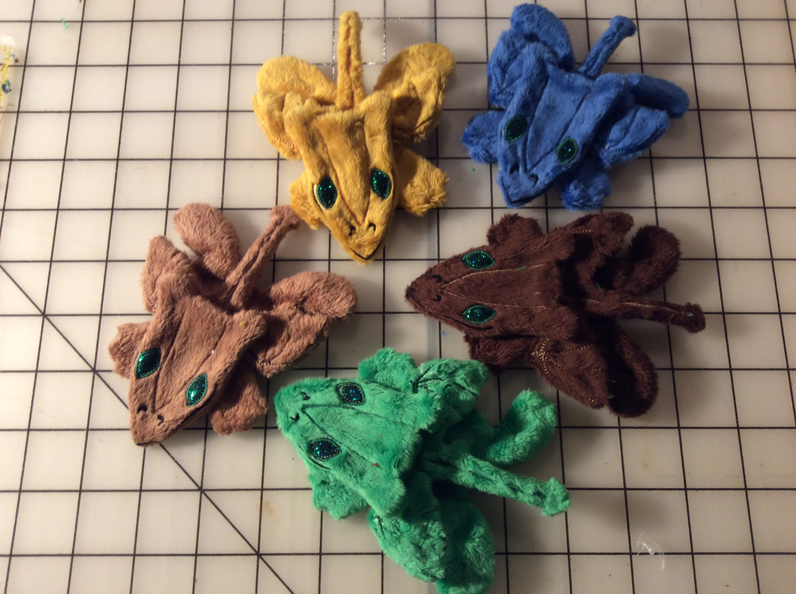 Five plush dragons, awaiting stuffing.