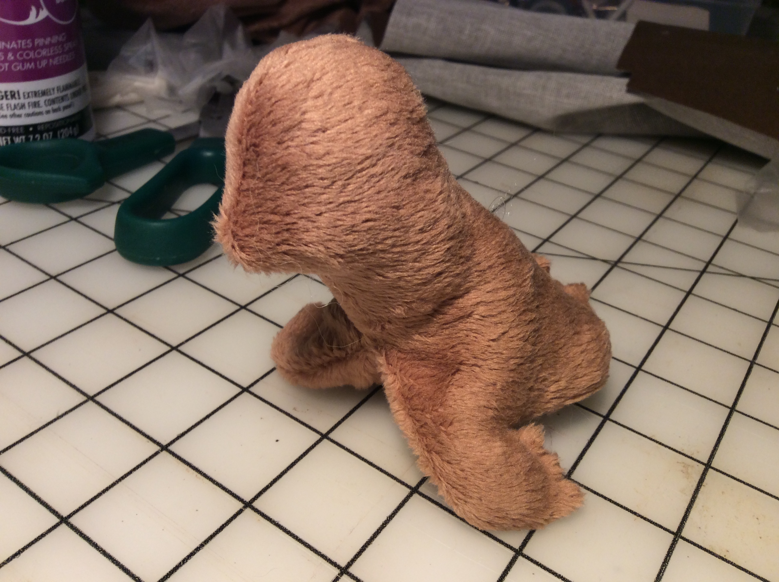An eyeless plush seal with a too-long neck.