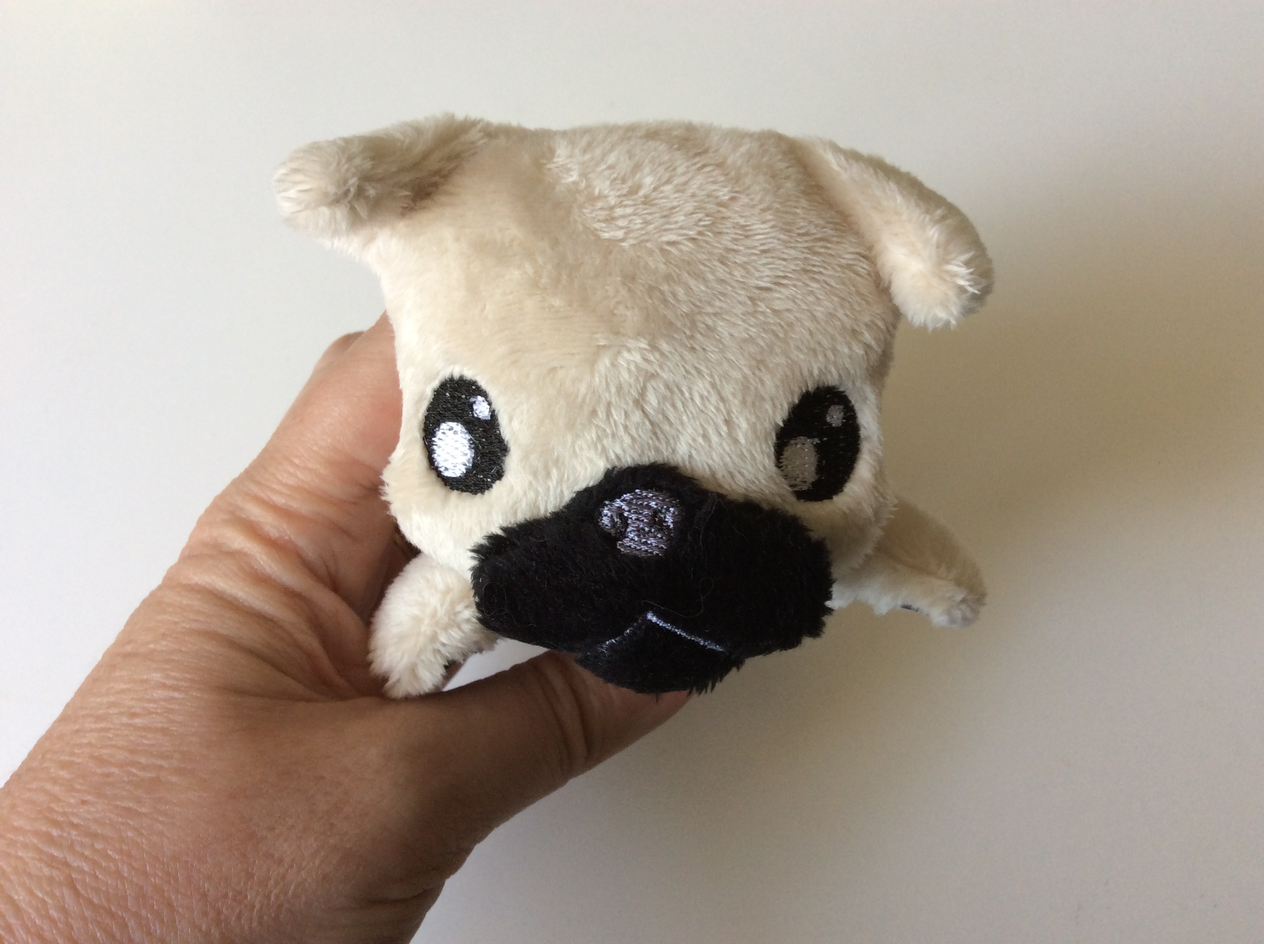 Plush pug face