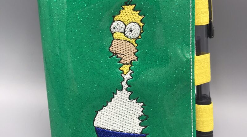 Homer fades into the... notebook cover